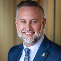 Brett K Rhodes